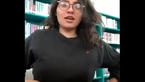 Beautiful College girl with nerd glasses flashing the most perfect tits in her schools library