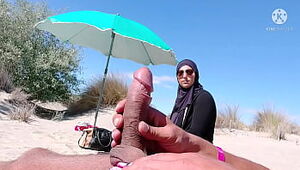 I shocked this muslim by pulling my cock out on the public beach, OMG her husband will be here soon